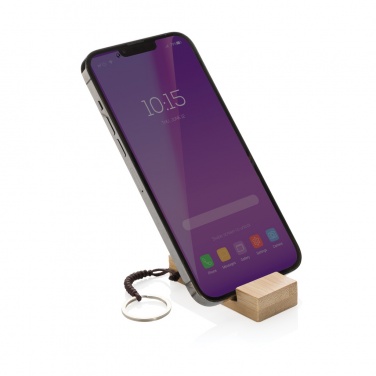 Logotrade Firmengeschenke das Foto: Standkey Bambus Schlüsselanhänger Telefonständer