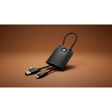 Black Le Sellier Etui charging cable with combined connectors out of the leather case and cable loop