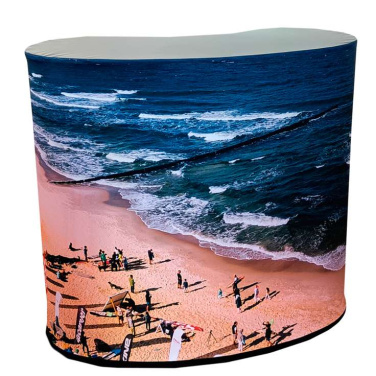 Oval promotiondisk med tryckt grafik av hav och strand